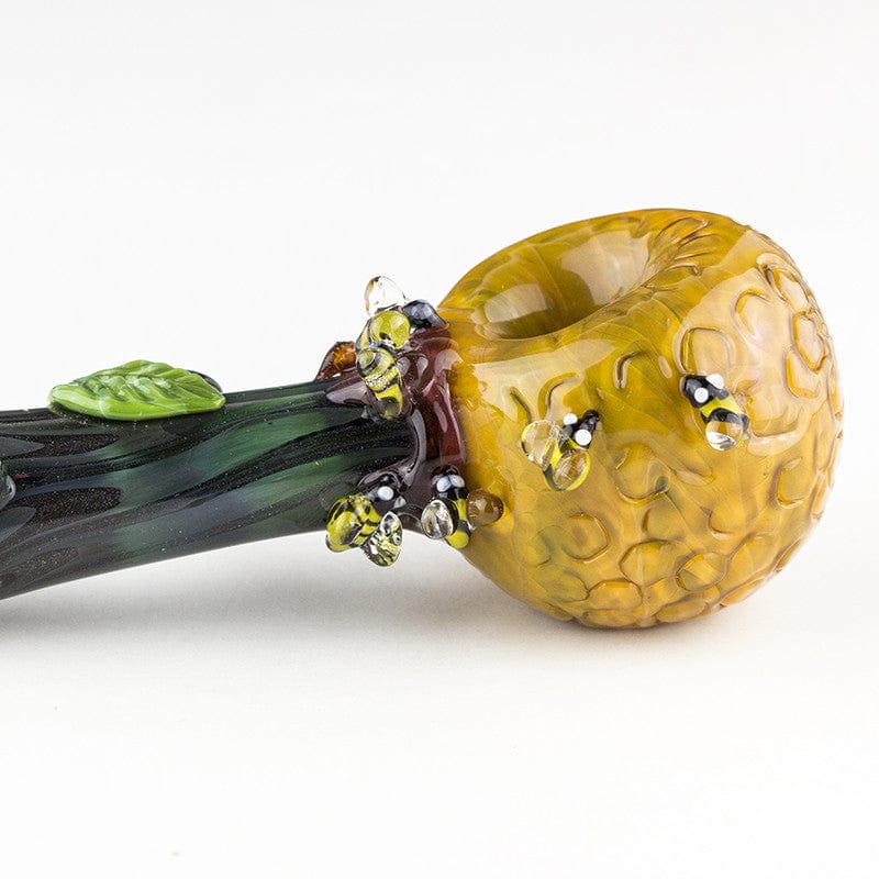 A side view of the Beehive Large Spoon Pipe, showing a textured yellow bowl and green accents.