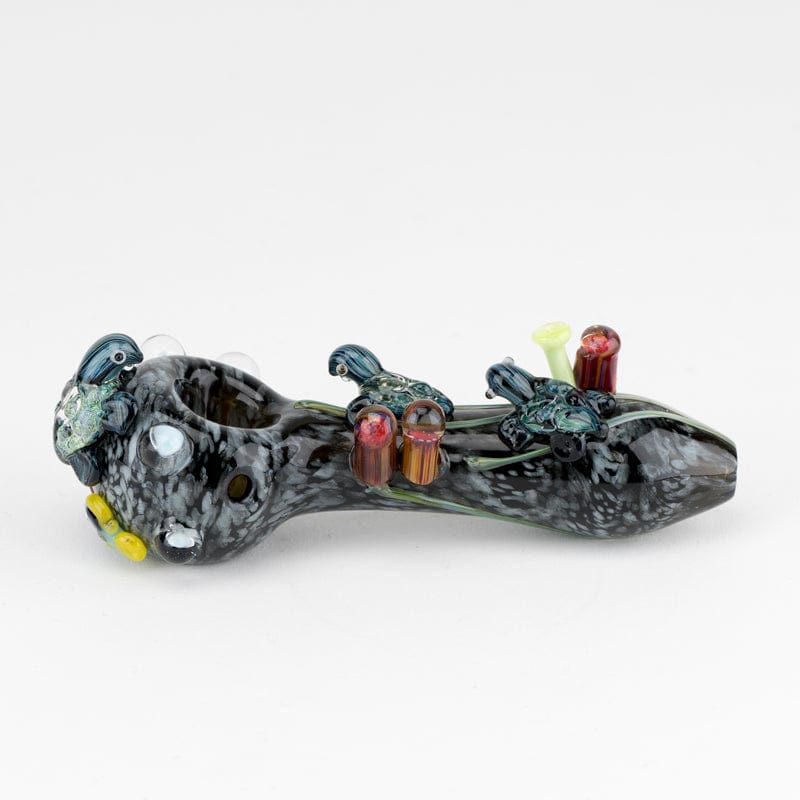 Front view of the East Australian Current Small Spoon Pipe, a sculpted glass pipe with swirling grey and blue patterns.