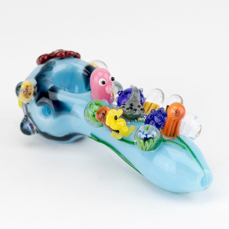 A detailed close-up of the Great Barrier Reef Small Spoon Pipe, showcasing colorful sculpted details along the curved bowl.