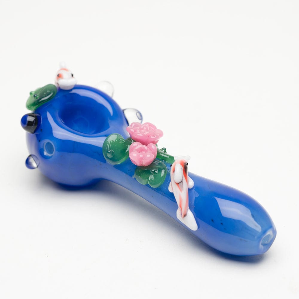 A side view of the Koi Pond Mini Spoon Pipe, showcasing sculpted koi fish adorning the blue glass bowl.