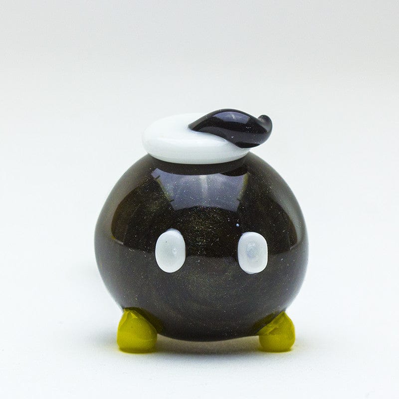 Front view of the Bomber Spoon Pipe, showcasing its smooth, rounded form and yellow footed base on a white background.