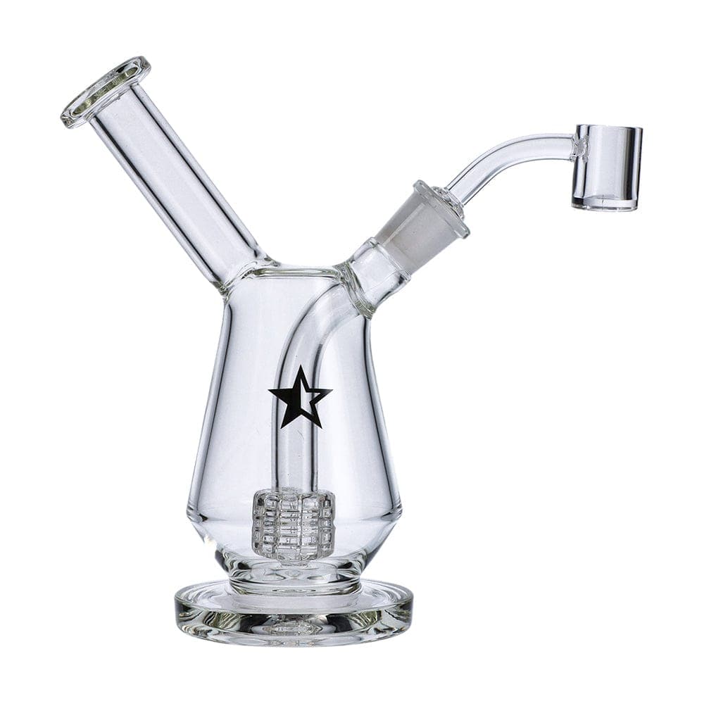 A three-quarter view of the Famous X 7" Drip Dab Rig, featuring a clear glass construction and a compact, rounded base.