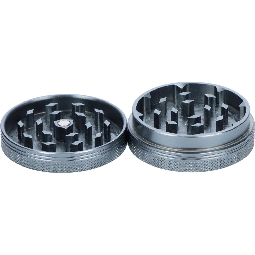 Overhead view of the open Famous X 55mm 1-Stage Grinder in chrome, showcasing its internal grinding teeth.