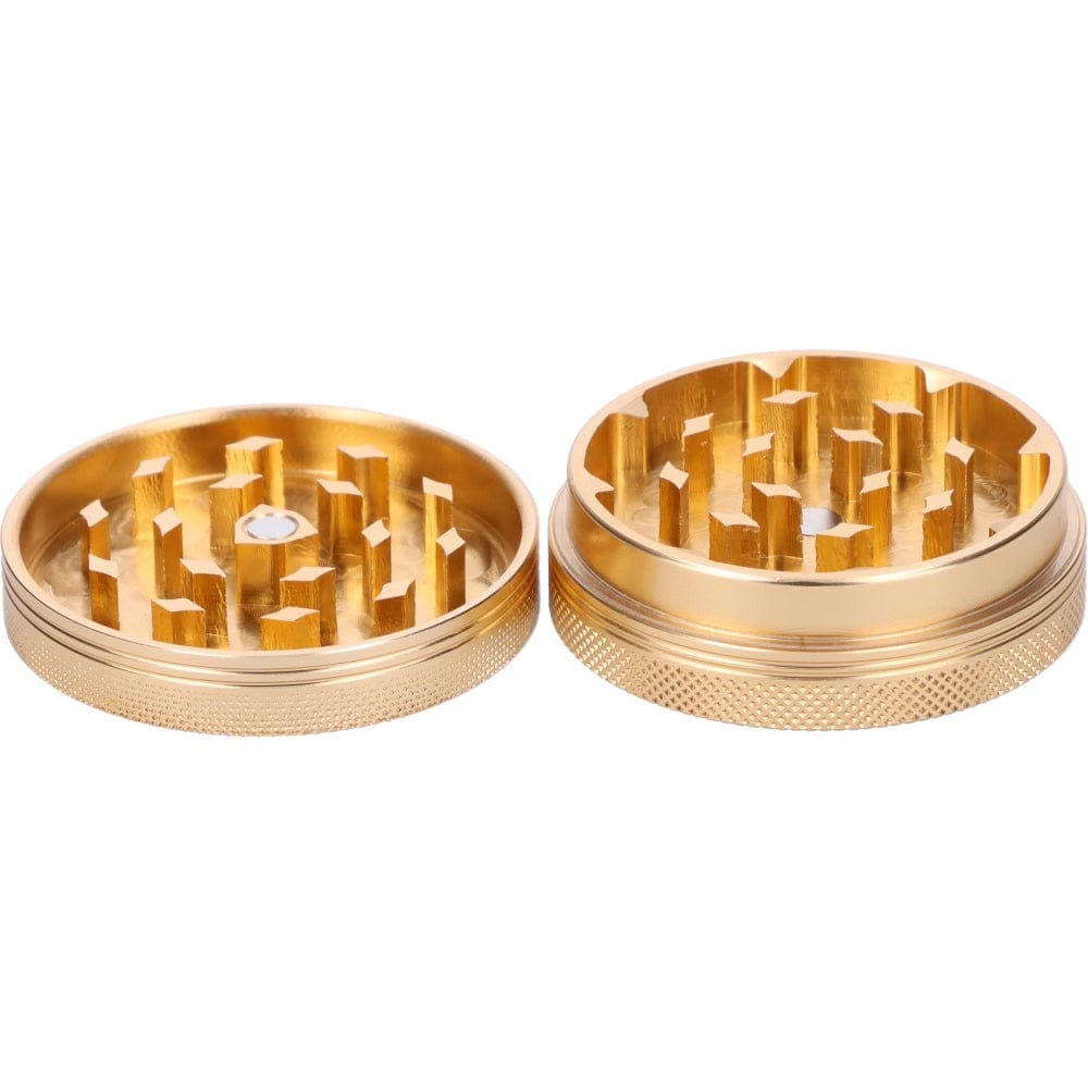 A top-down view of the gold Famous X 55mm 1-Stage Grinder, showing its circular multi-tiered grinding mechanism.