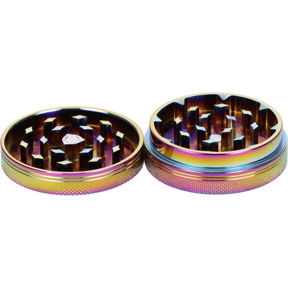A close-up, top-down view of the open Famous X 55mm 1-Stage Grinder, showing the metallic grinding teeth inside.