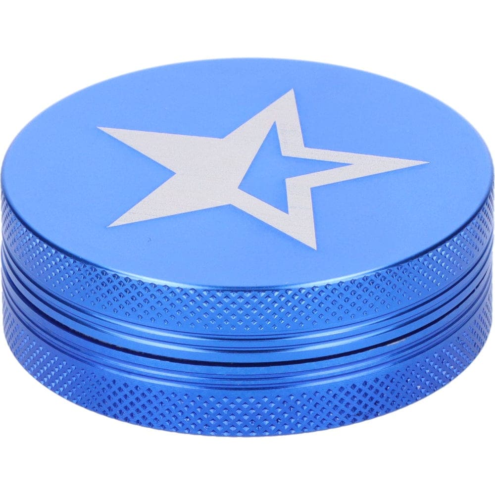 A close-up, angled view of the Famous X 55mm 1-Stage Grinder in sapphire blue, showcasing its textured, cylindrical design.