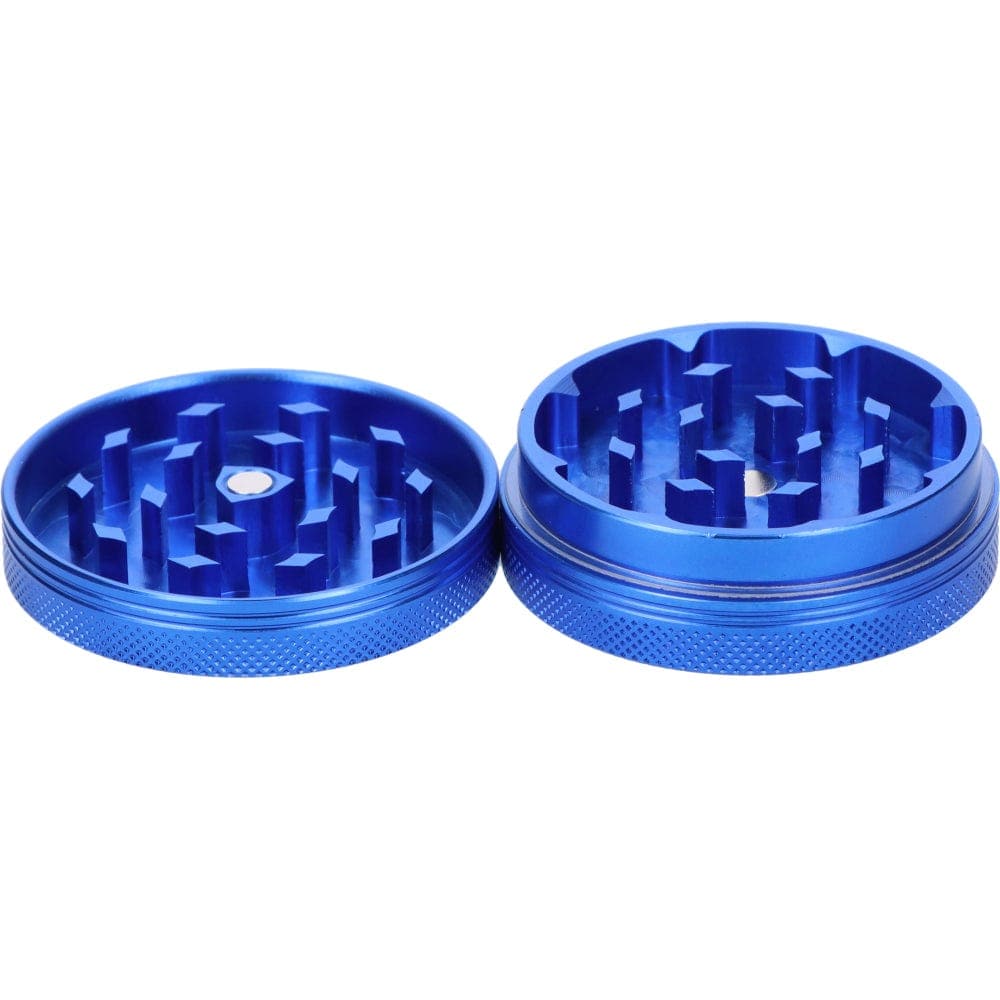 Close-up of the open Famous X 55mm 1-Stage Grinder, showcasing the sapphire-colored teeth and circular design.