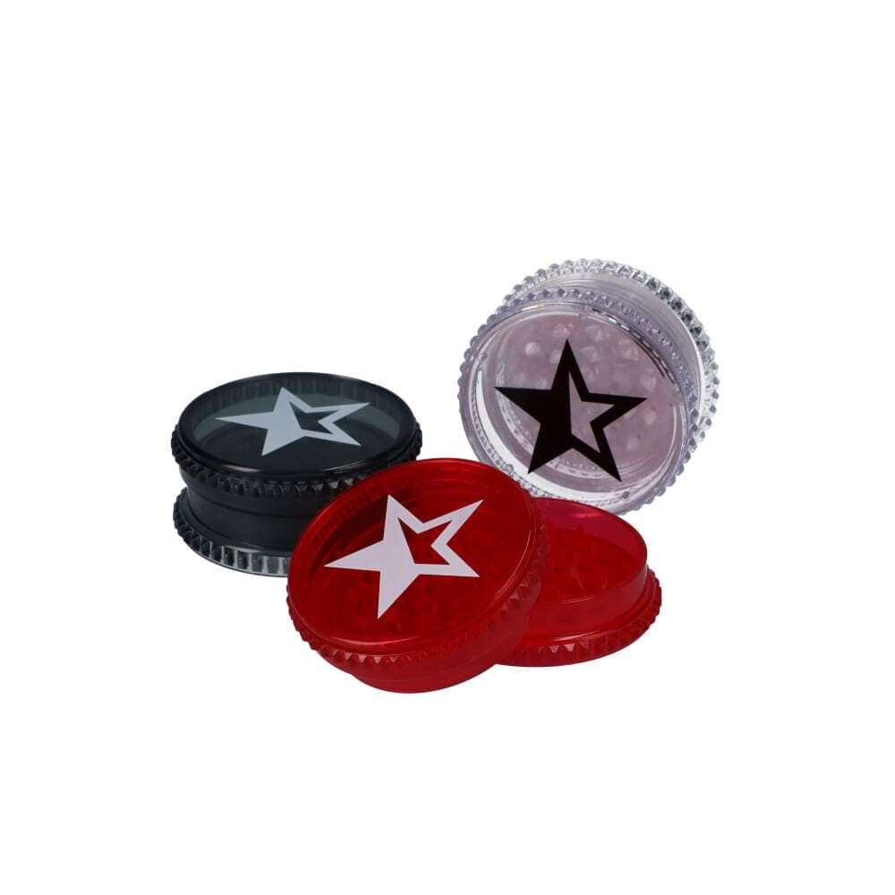 Overhead shot of a tray of twelve 59mm Famous X Acrylic Grinders, showing their circular shape and metallic finish.