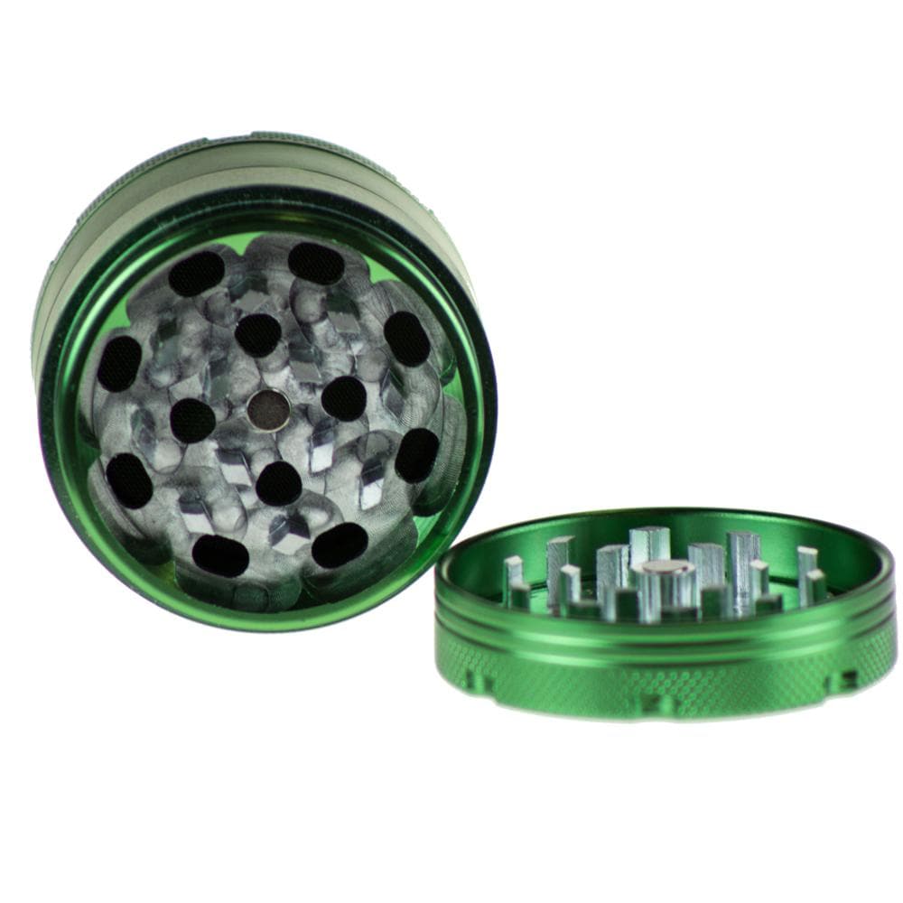 Top-down view of the open Famous X Up In Smoke 50mm 4-Piece Grinder, revealing its multi-tiered, metallic grinding mechanism.