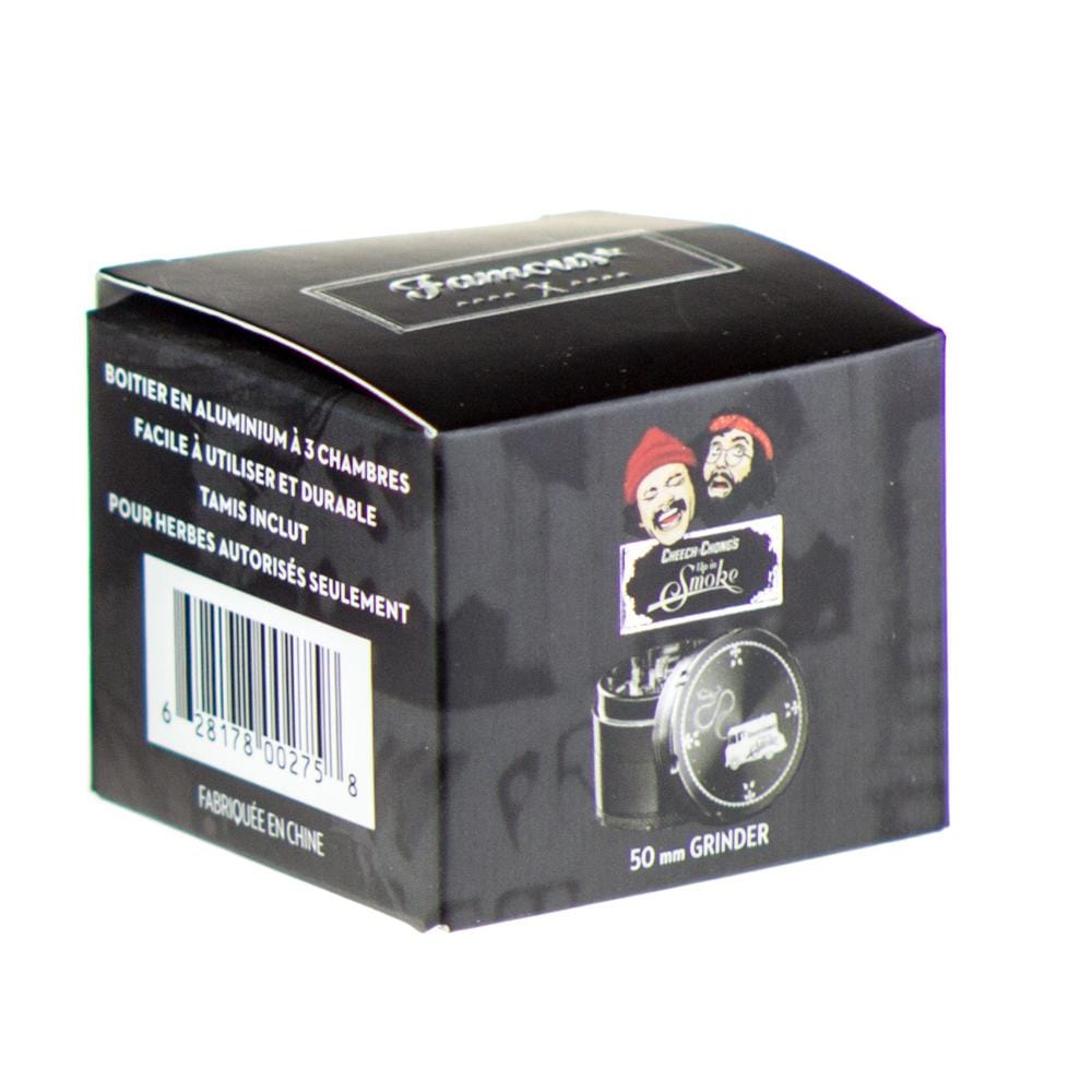 Front view of the Famous X Up In Smoke 50mm 4-Piece Grinder, with French text and a silver metallic finish.