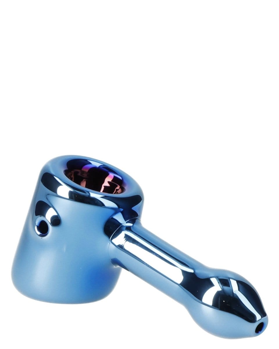 A side view of the Famous X 4" Sapphire Fumed Hammer Pipe, showcasing its blue-tinted glass and compact design.