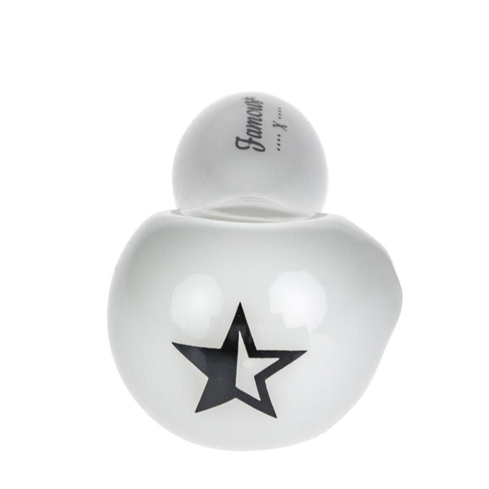 A close-up shot of the Famous X 4" Spoon Pipe, showing its curved design and smooth finish.