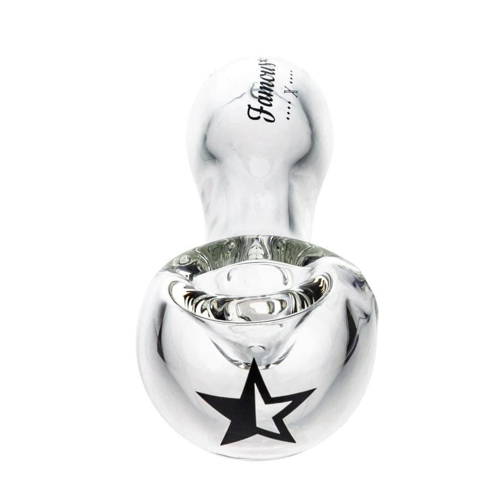 A studio shot of the Famous X 4" Spoon Pipe, featuring a clear glass bowl angled from a high perspective.