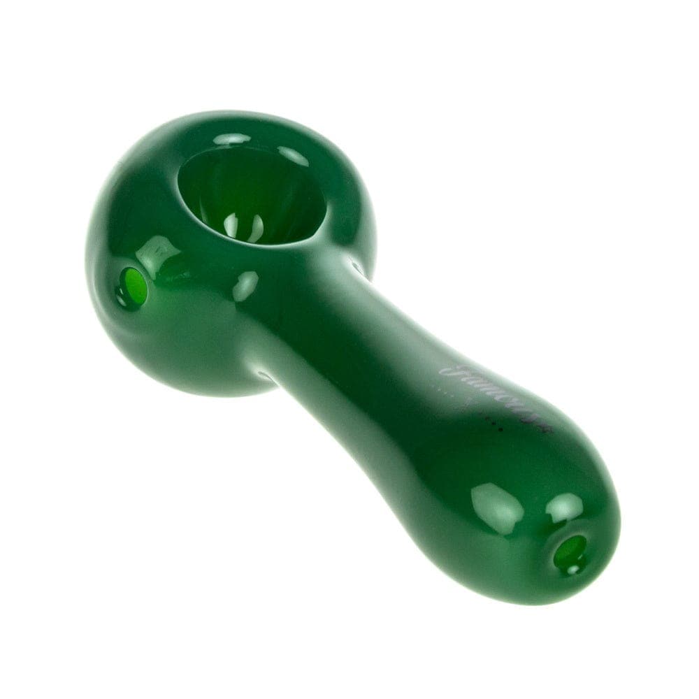 A side view of the Famous X 4" Spoon Pipe, showcasing the smooth, curved design of the green glass pipe.
