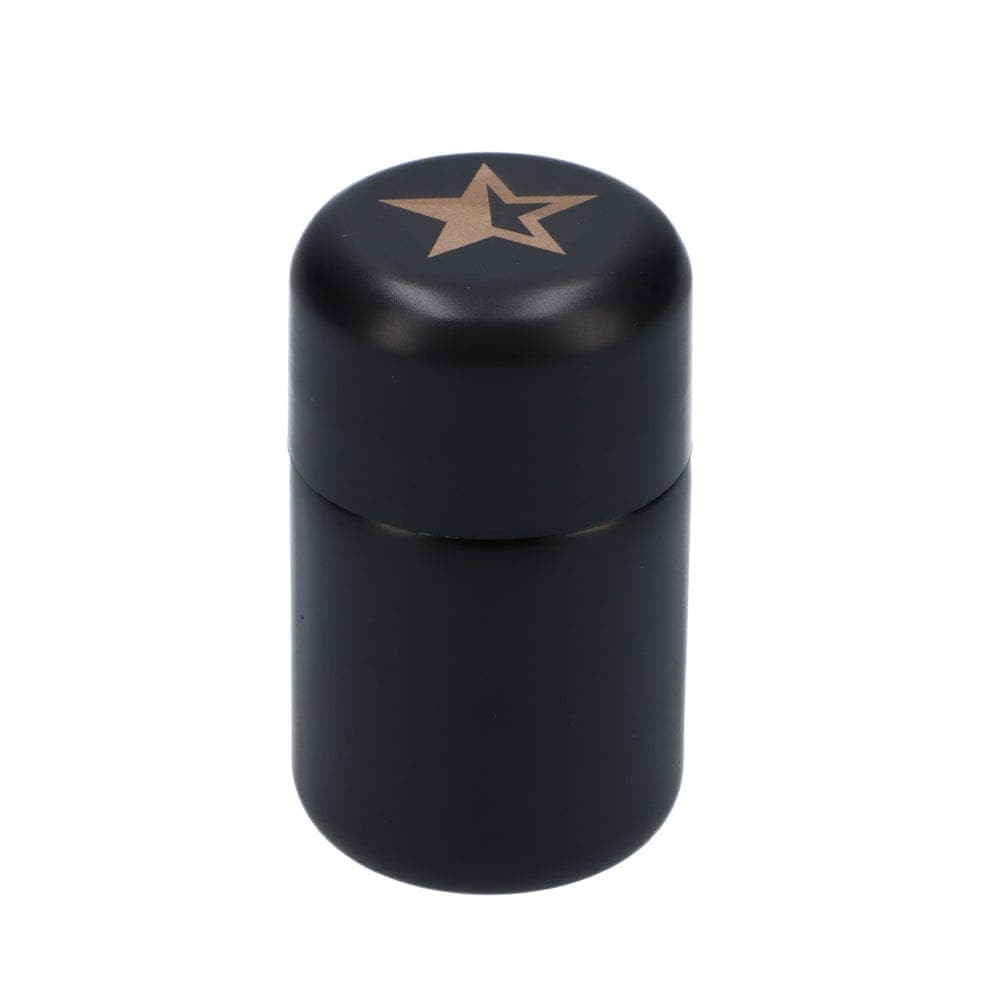Front view of the Black Glass Stash Jar, a dark glass container with a simple cylindrical shape.