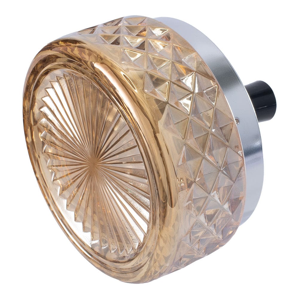 A side view of the Gem-cut Glass Spinning Ashtray, showcasing the textured glass and silver-tone rotating base.