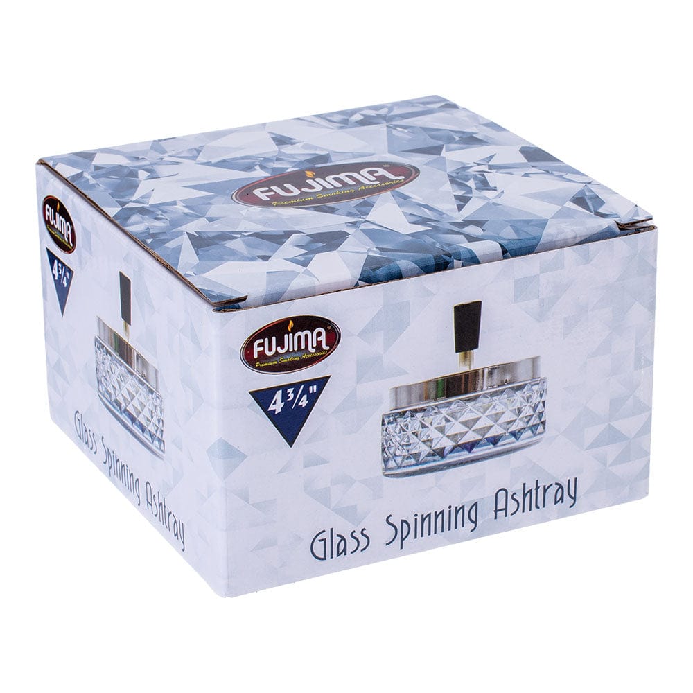 A top-down view of the Gem-cut Glass Spinning Ashtray, featuring a clear, faceted glass design.