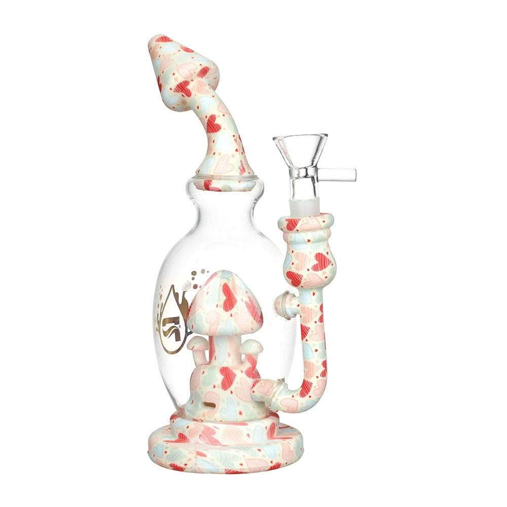 A three-quarter view of the Pulsar Shroom Celebration Water Pipe, showcasing its mushroom-shaped design in translucent pink glass.