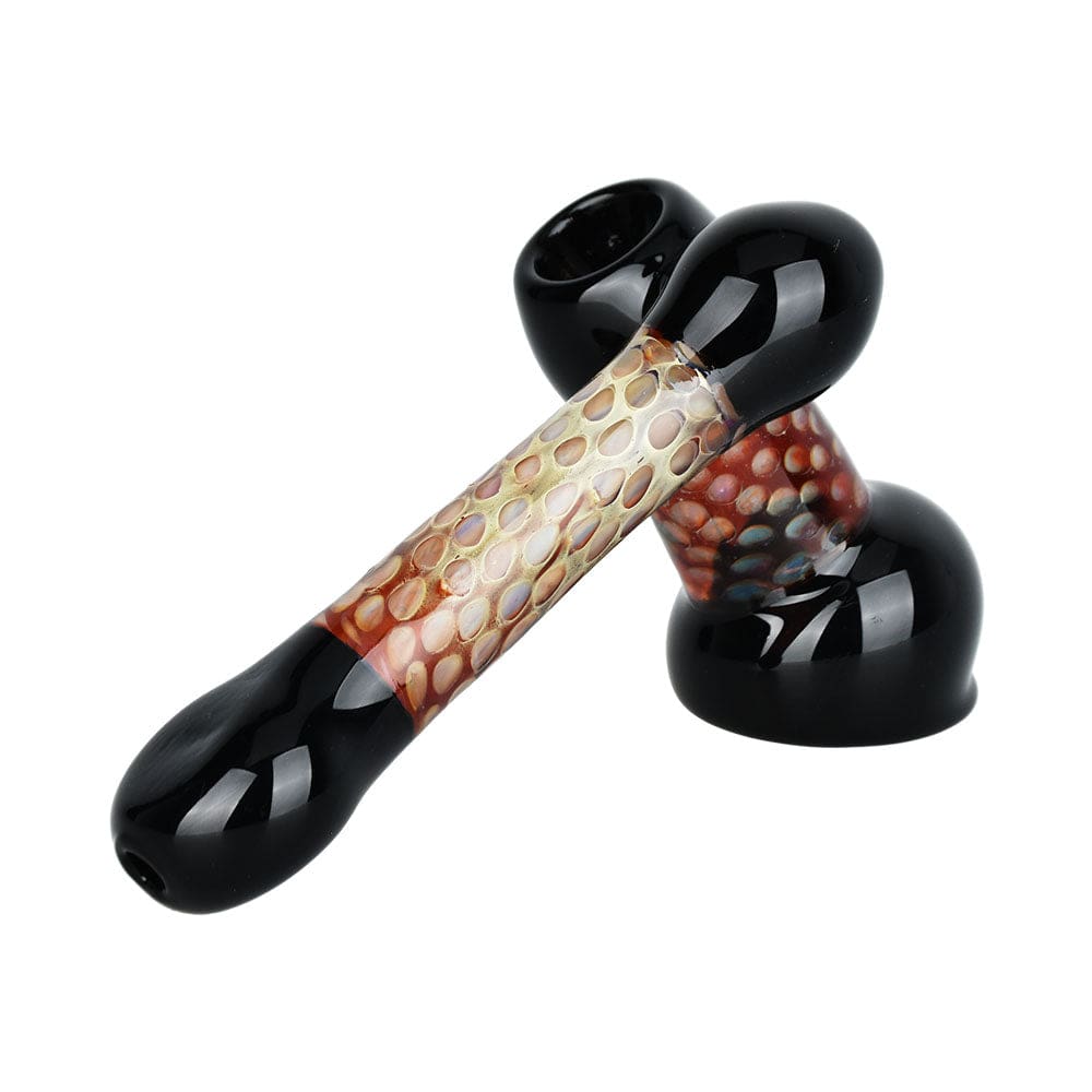 A side view of the 5-inch Honeycomb Hype Sidecar Bubbler Pipe, showcasing its curved design and clear glass construction.