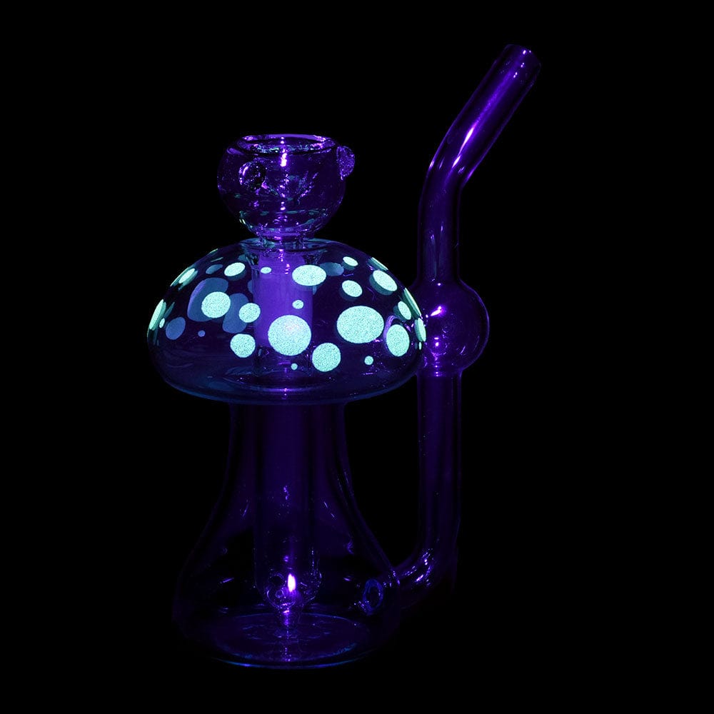 A three-quarter view of the Phosphorescent Fungi Glow in the Dark Glass Bubbler, featuring a textured, patterned glass body.