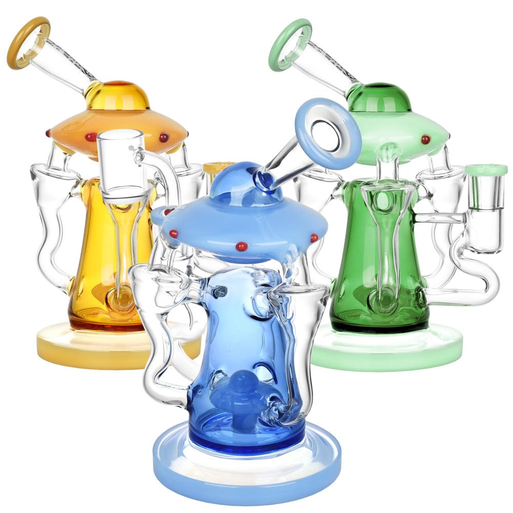 A front view of the Pulsar Friendly Visitors Recycler Dab Rig in varying colors, showcasing its unique, rounded shape and glass construction.