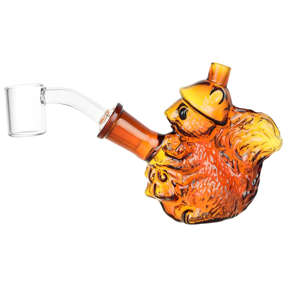 A side view of the 3.5-inch Nuts For Dabs Squirrel Mini Dab Rig, featuring a clear glass build and whimsical squirrel design.