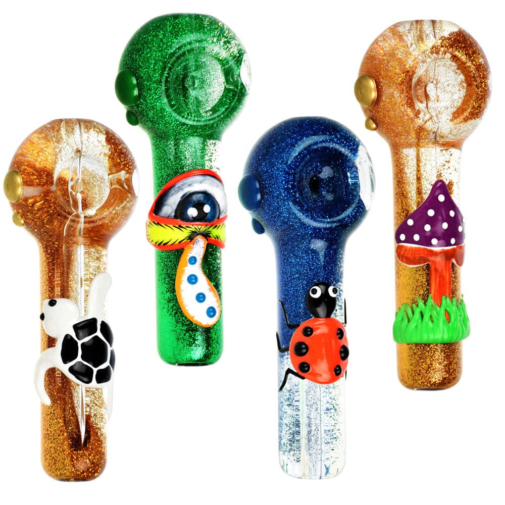 A colorful arrangement of the 5" Freezable Glycerin Glitter Glow Spoon Pipes, each uniquely styled with glitter and whimsical designs.