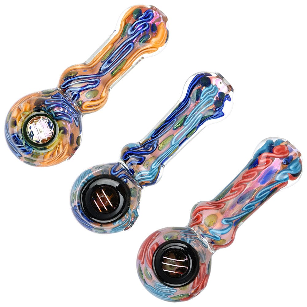 A close-up, angled view of the Lustrous Fumed Glass Spoon Pipe - 4.25", showcasing colorful glass swirls and a rounded bowl.