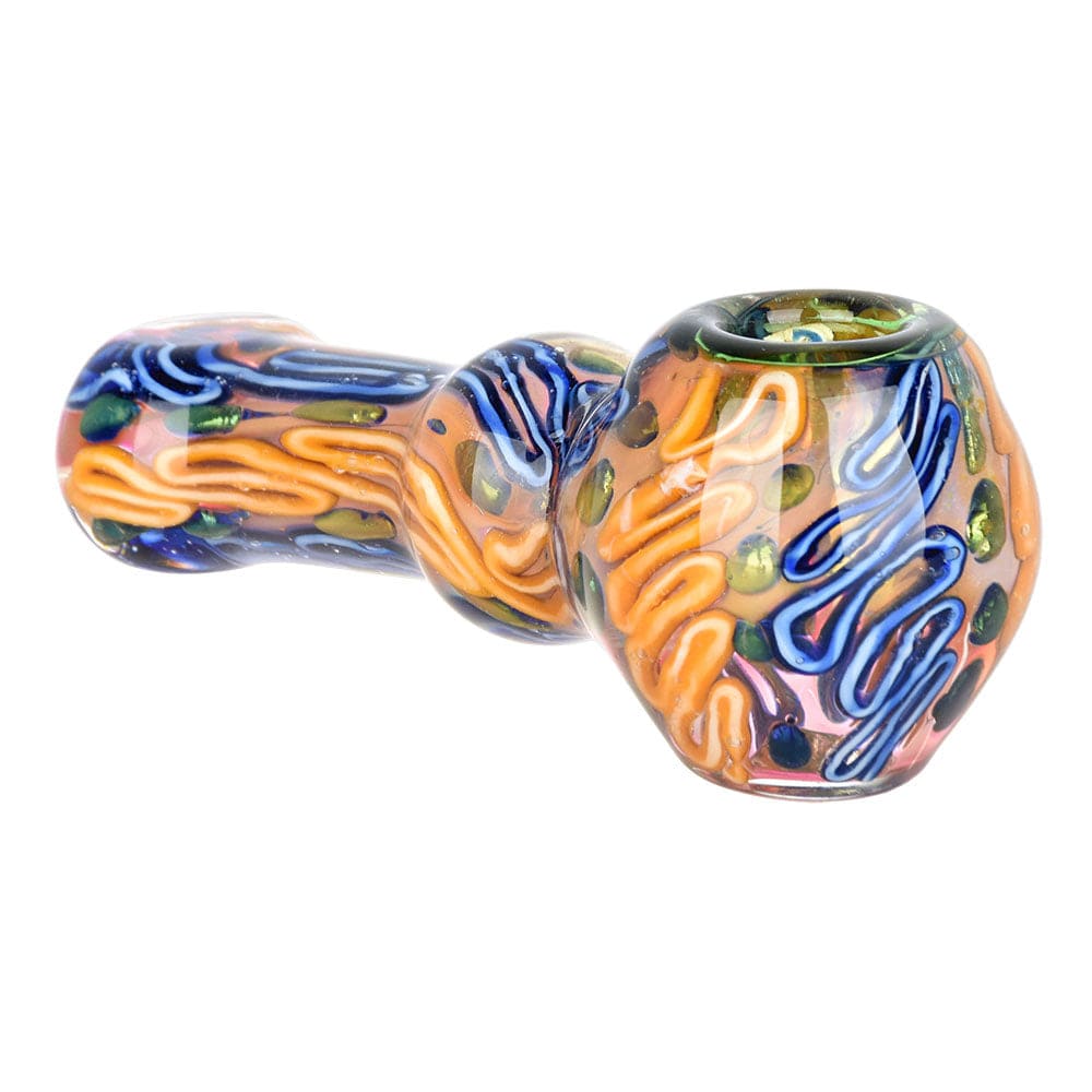 A close-up, angled view of the Lustrous Fumed Glass Spoon Pipe - 4.25", showcasing its colorful glass swirl design.