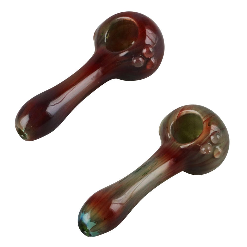 A side view of the Streaked Spoon Pipe - 4.25", showing the colorful, swirled glass design.