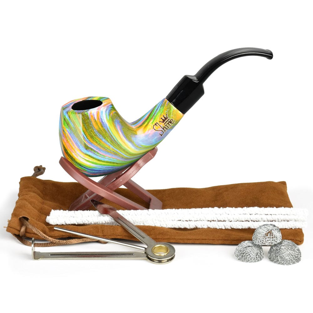 A three-quarter view of the Pulsar Shire Pipes The Firebow  Bent Brandy Saddle Stem Rainbow Wood Pipe resting on a dark wooden stand.