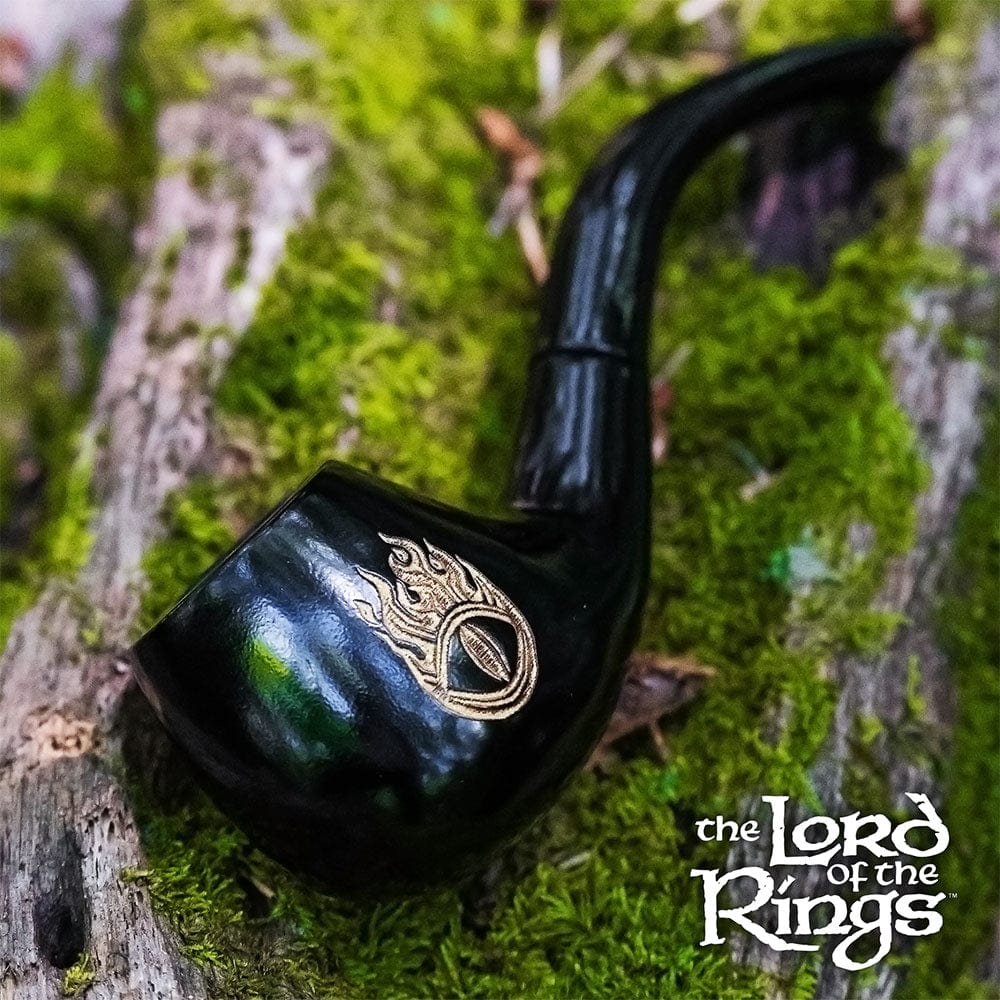A close-up, angled view of the Pulsar Shire Pipes SAURON Smoking Pipe, showing its dark finish against a mossy backdrop.