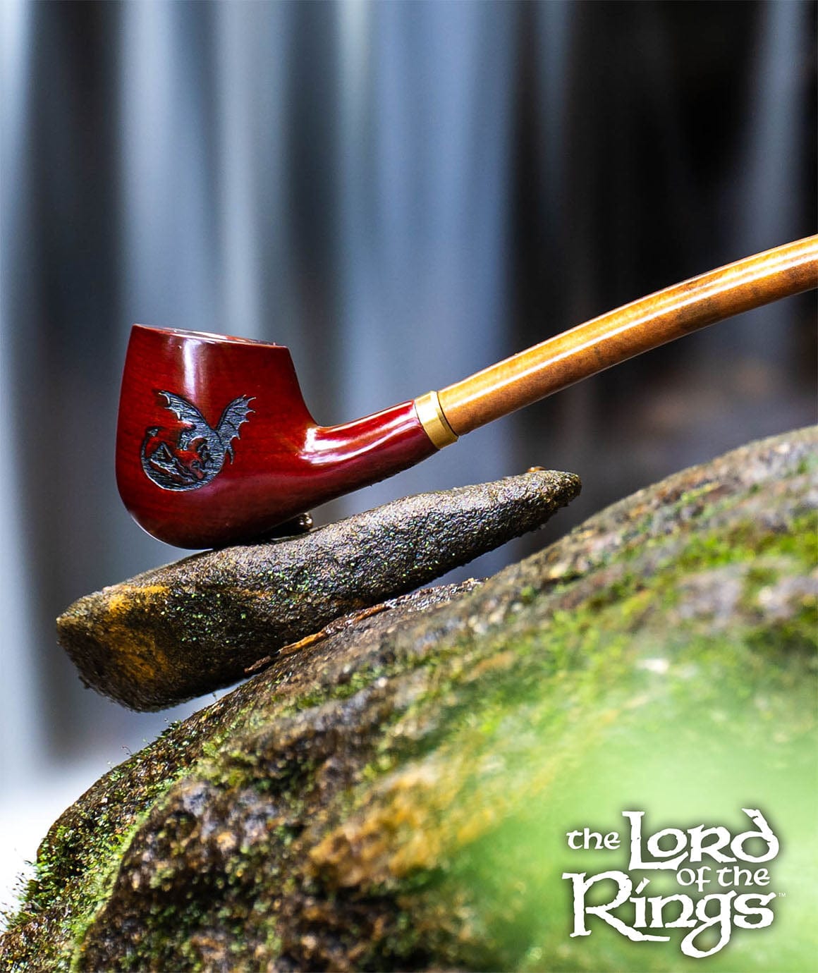 A close-up, angled view of the 11.5” Pulsar Shire Pipes SMAUG Smoking Pipe resting on a textured gray surface.