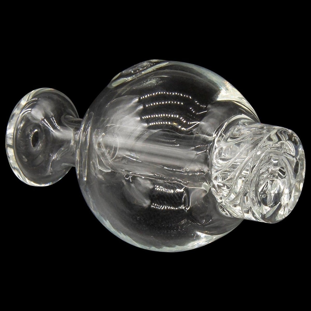 A close-up, angled view of the Glasshouse "Ice Set" Rounded Base, showcasing the clear quartz kit’s concave flattop and rounded form.