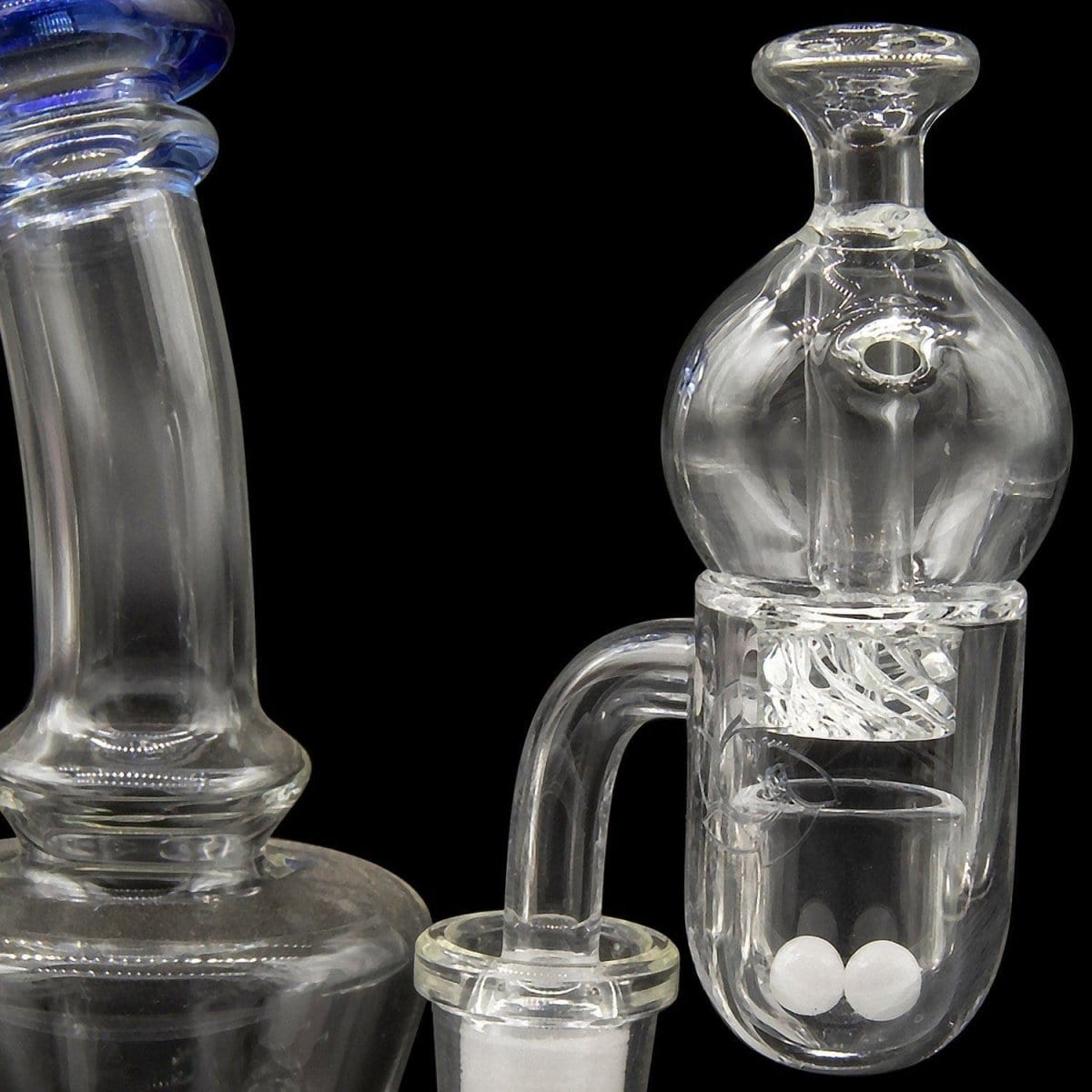 A close-up, angled view of the Glasshouse "Ice Set" Rounded Base 25m Concave Flattop Full Quartz Kit, showing clear glass and internal components.