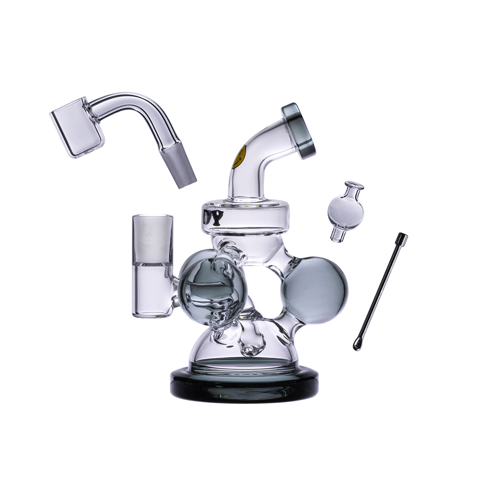 A three-quarter view showcases the Goofy Glass - Atom Mini Dab Rig 4-Piece Kit, featuring a clear glass rig with various components arranged around it.