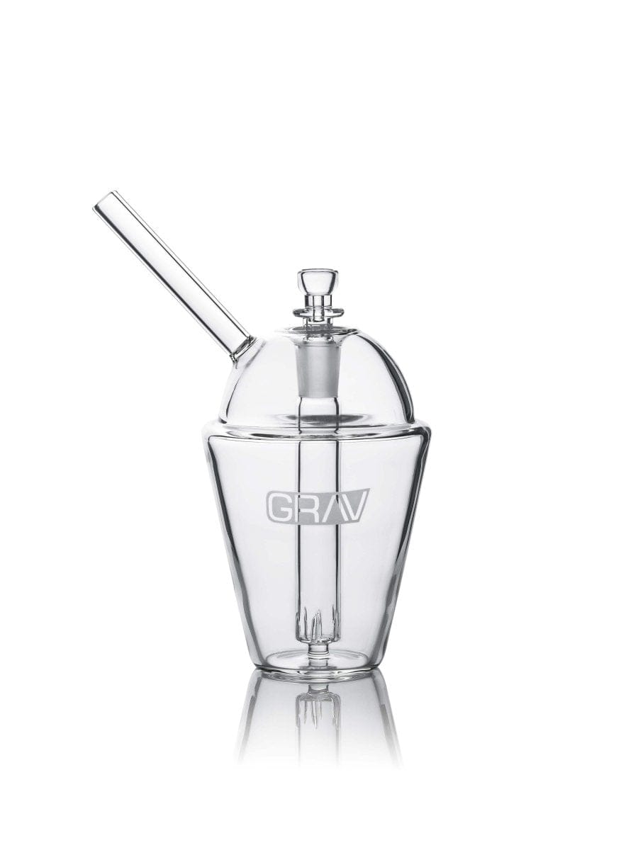 A studio shot displays the GRAV® Slush Cup Bong, showcasing its clear glass construction and simple, rounded form.