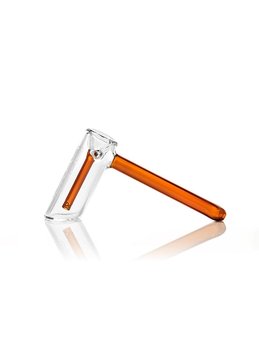 Side view of the GRAV® Hammer Bubbler, a clear glass bubbler reflecting on a smooth surface.