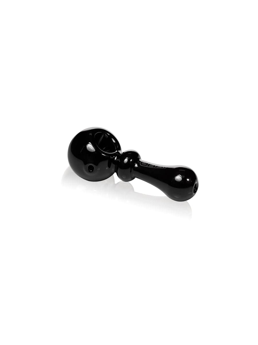 A side view of the GRAV® Bauble Spoon, showing its smooth, dark glass curvature against a plain white background.