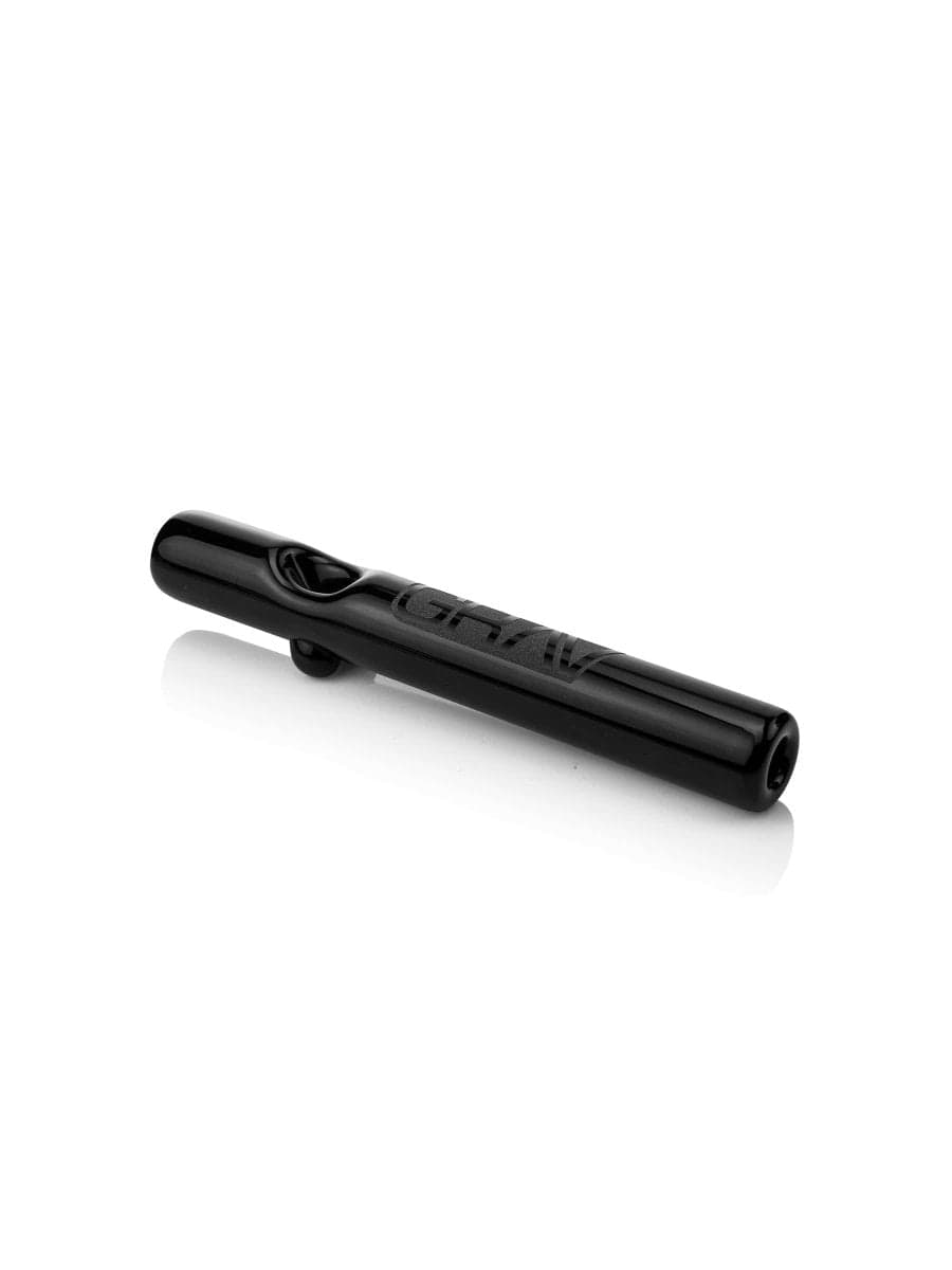 A side view of the GRAV® Classic Steamroller, with its clear glass body resting on a reflective surface.