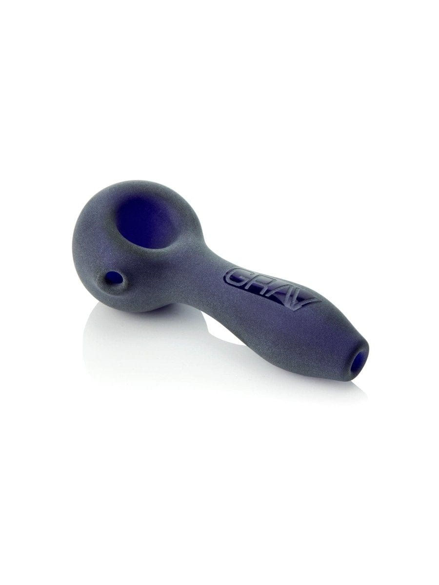 A side view of the GRAV® Sandblasted Spoon Pipe, with a smooth, dark finish and a subtly curved design against a white background.