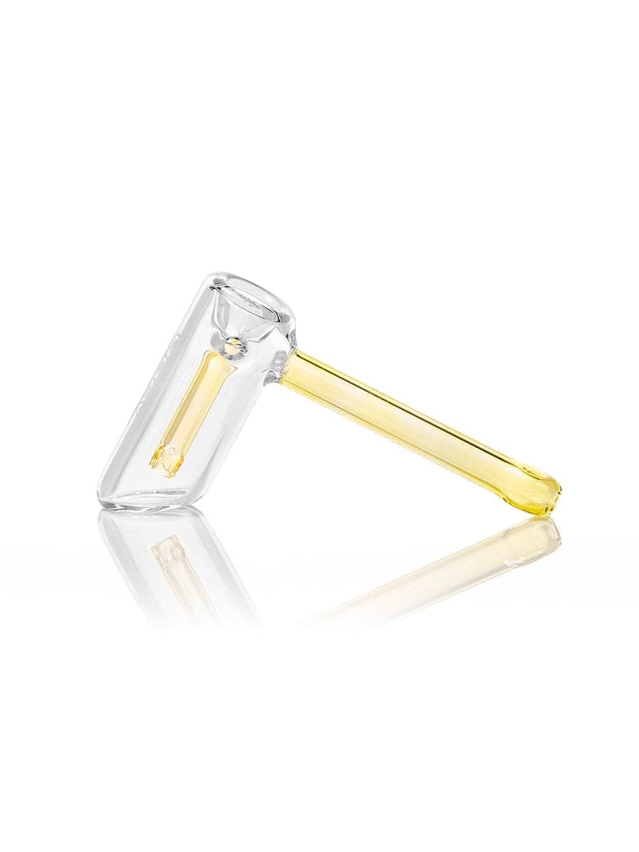 A side view of the GRAV® Mini Hammer Bubbler, showcasing its clear glass construction and compact, rounded shape.