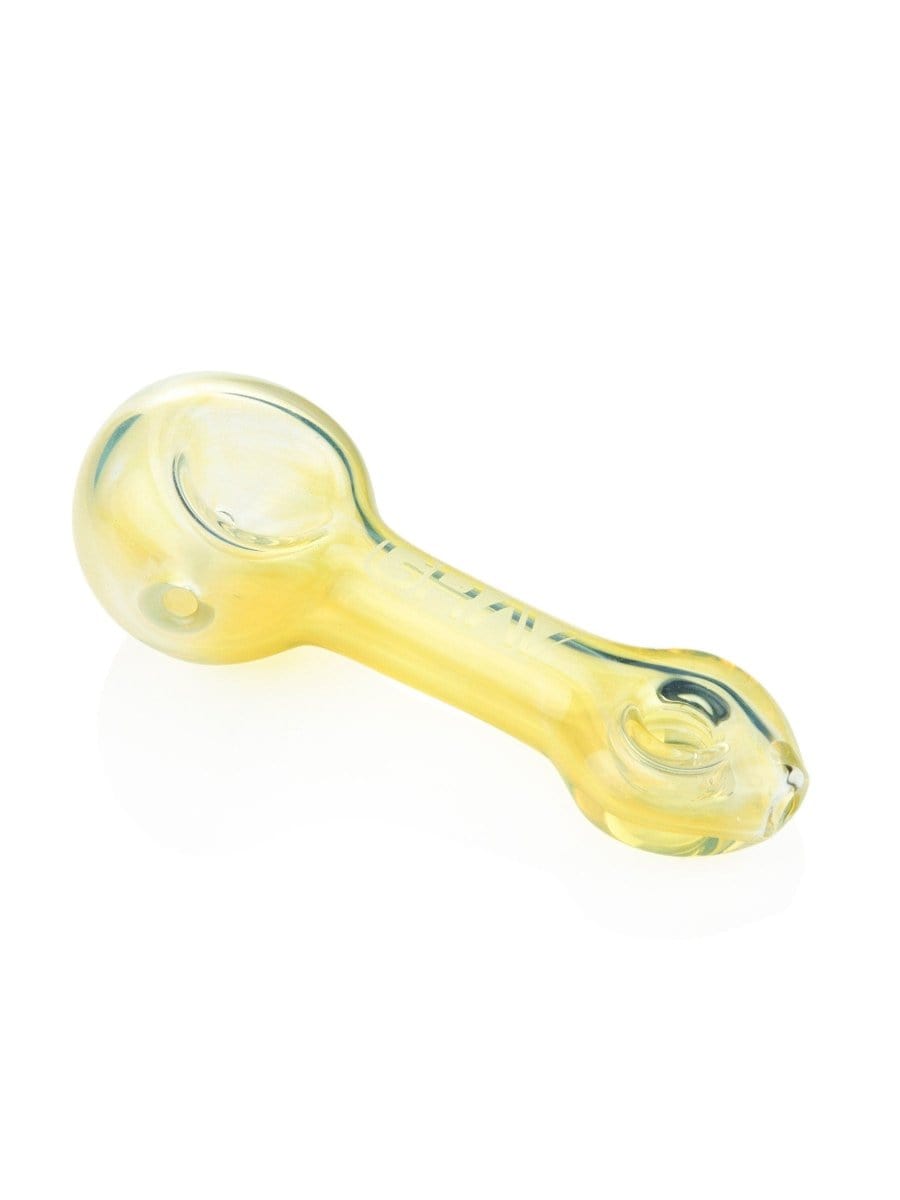 A three-quarter view of the GRAV® Mini Spoon Pipe, showcasing its smooth, curved form in clear glass.