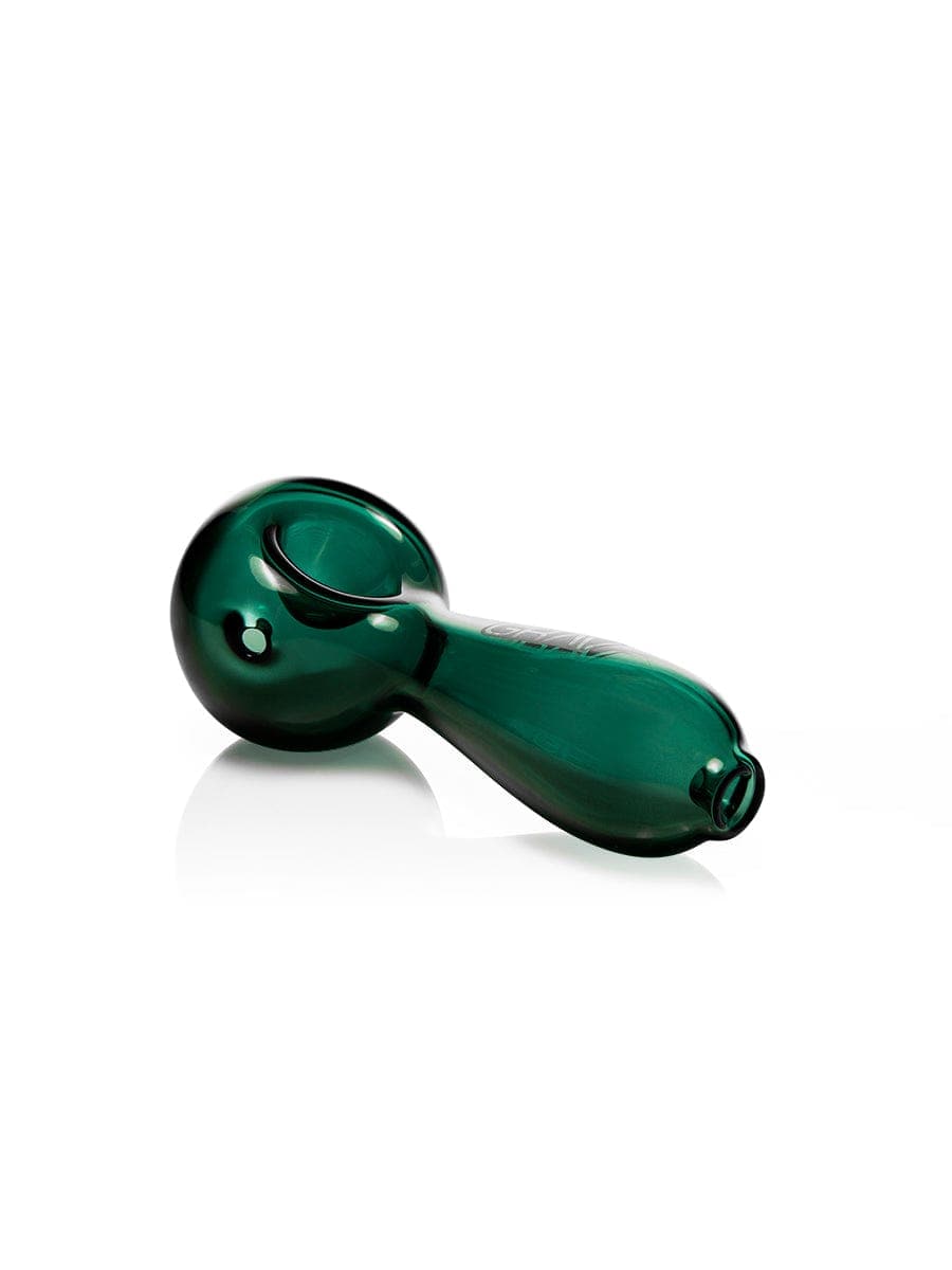 A three-quarter view of the GRAV® Large Spoon, a dark green glass pipe with a curved design and glossy finish.