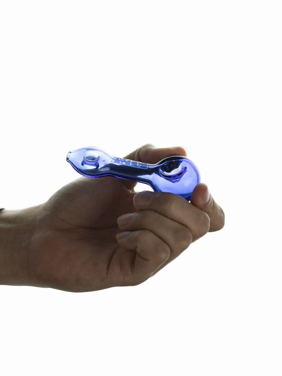 A hand holds the GRAV® Mini Spoon Pipe, displaying the curved shape and glossy finish in a close-up view.