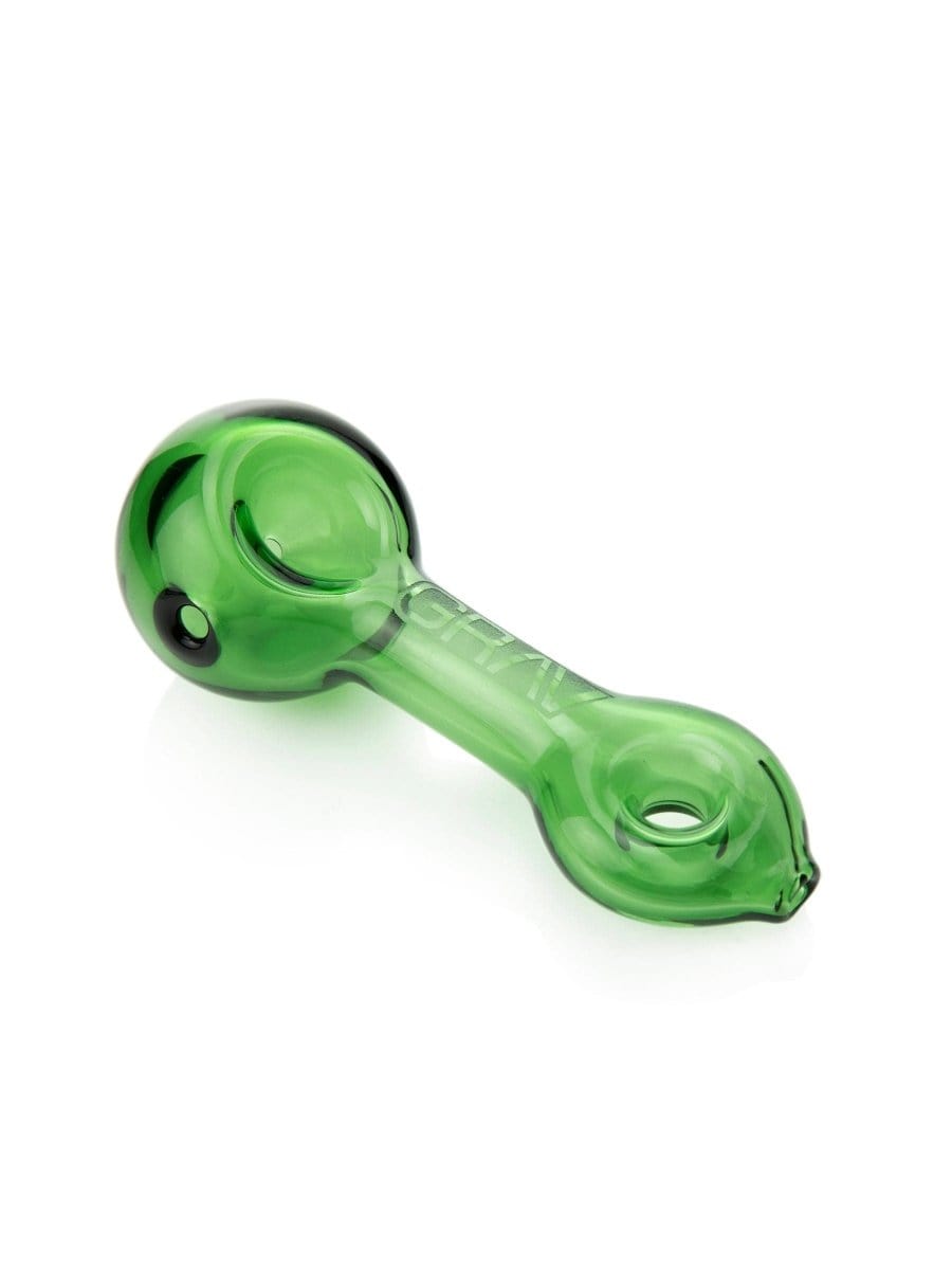 A three-quarter view of the GRAV® Mini Spoon Pipe in green glass, showing its curved shape and simple design.