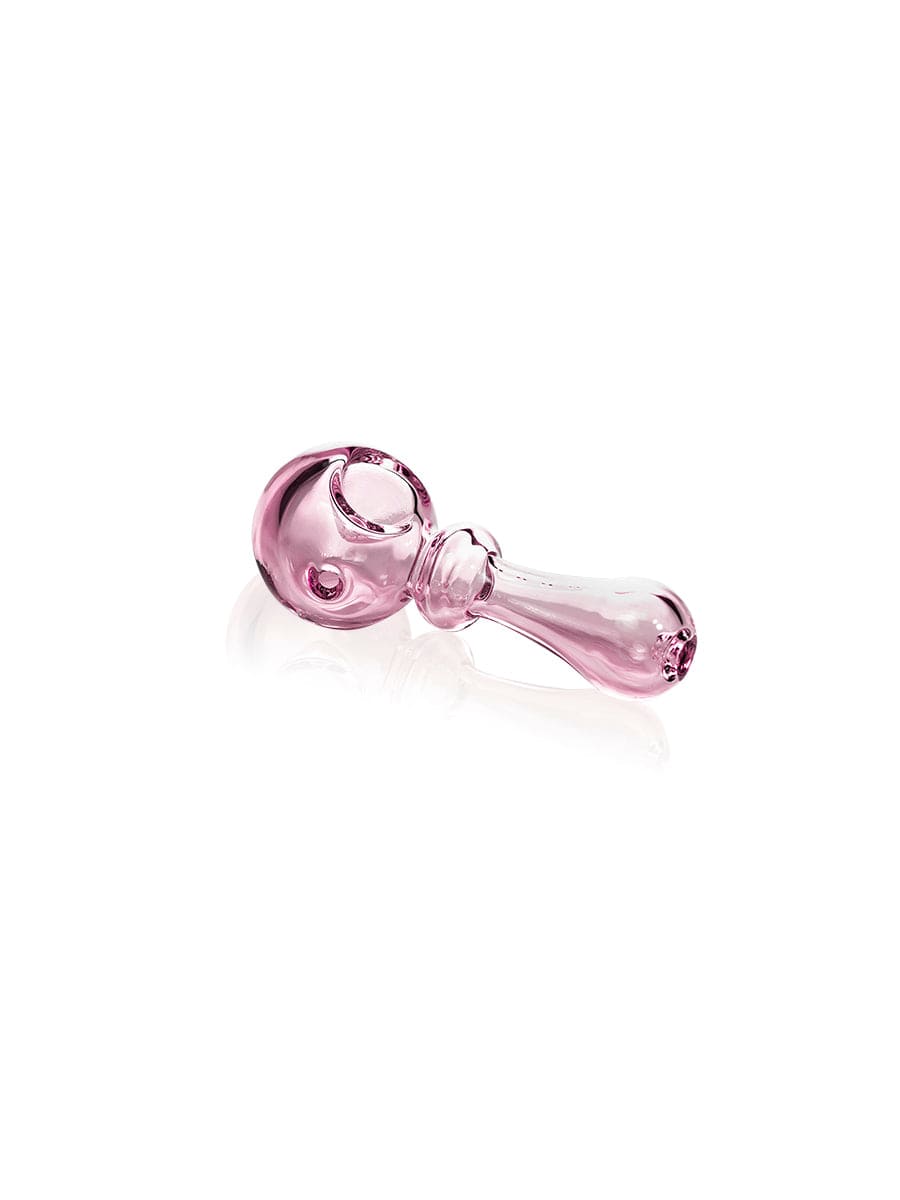 A close-up, angled view of the GRAV® Bauble Spoon, featuring a simple, clear glass design.