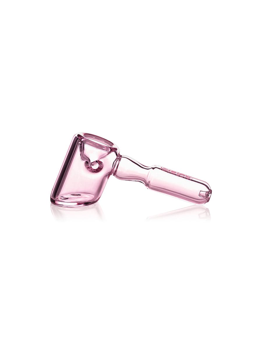 A side view of the GRAV® Hammer Hand Pipe, showcasing its curved form and smooth, clear glass construction.