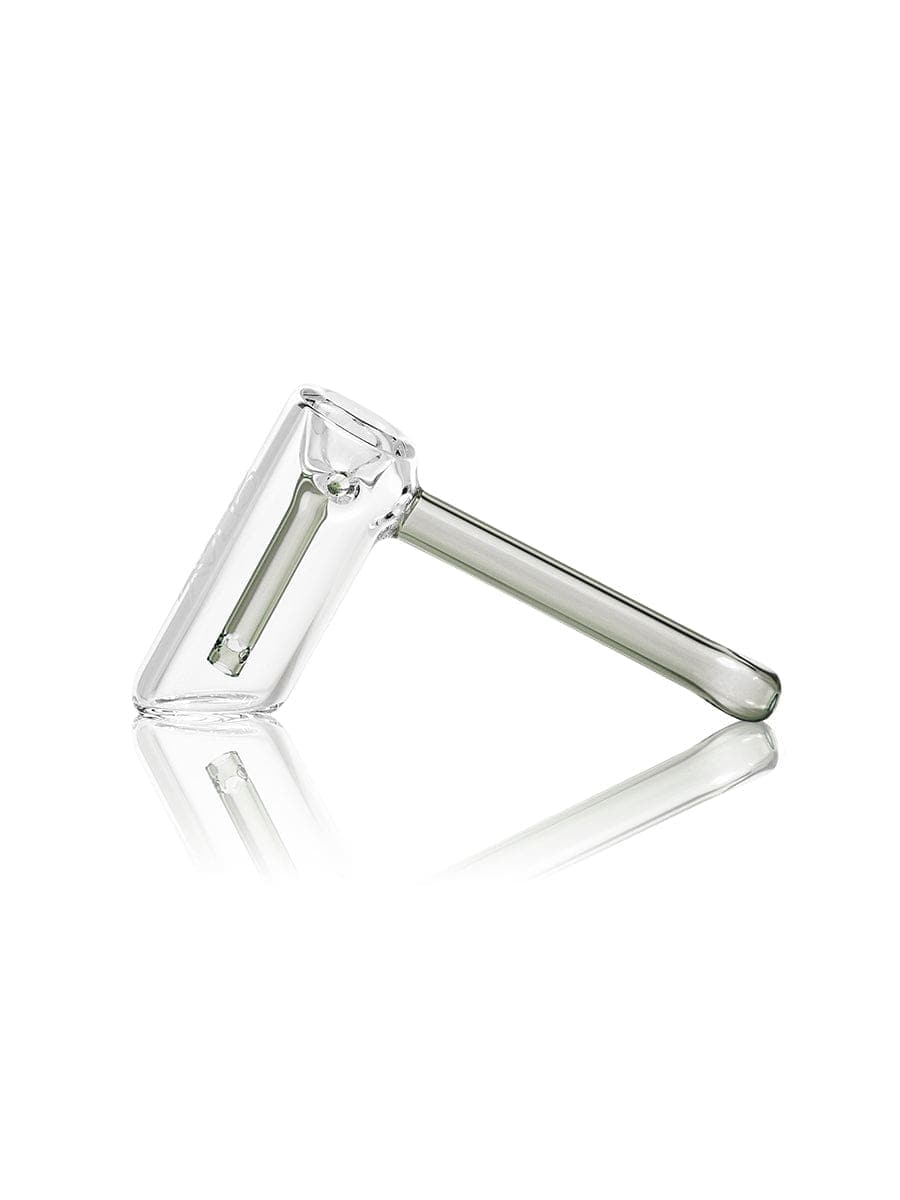 A side view of the GRAV® Mini Hammer Bubbler, showing its clear glass construction and compact, hammer-like shape.