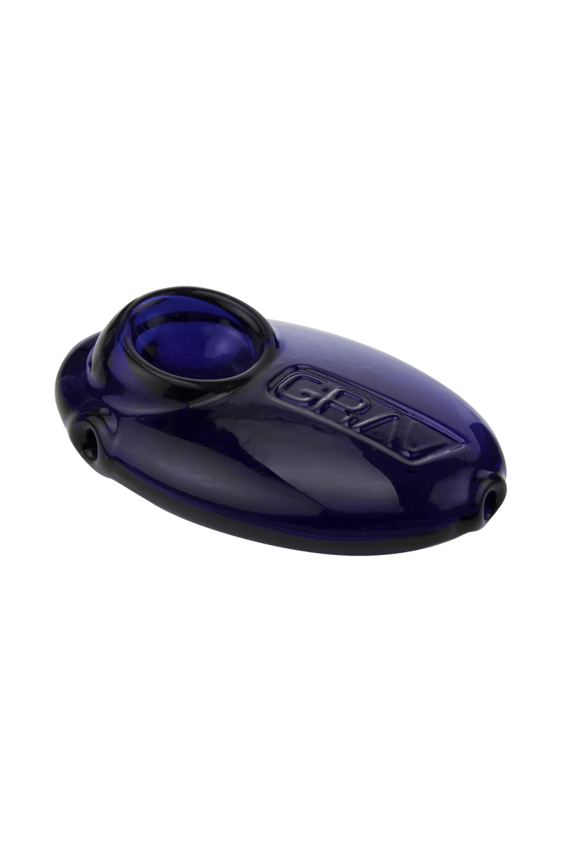 A three-quarter view of the Grav Labs Pebble Spoon, showing its smooth, dark blue glass construction.